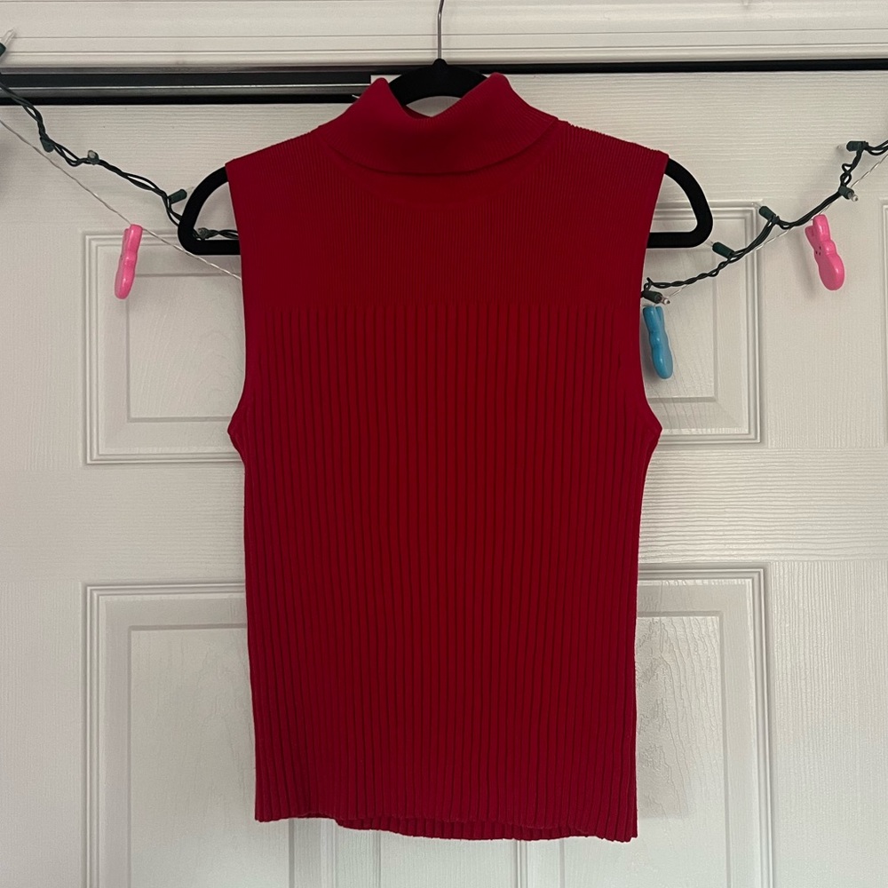 Sleeveless red knit turtleneck top